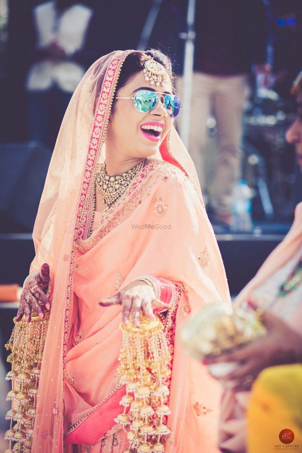 Photo of Bride wearing sunglasses and unique pearl kaleeras