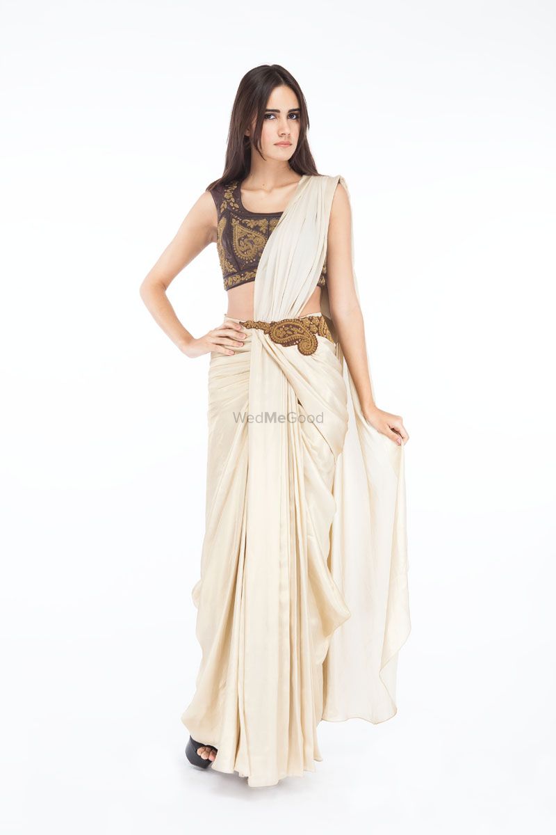 Photo of white and bronze gown saree
