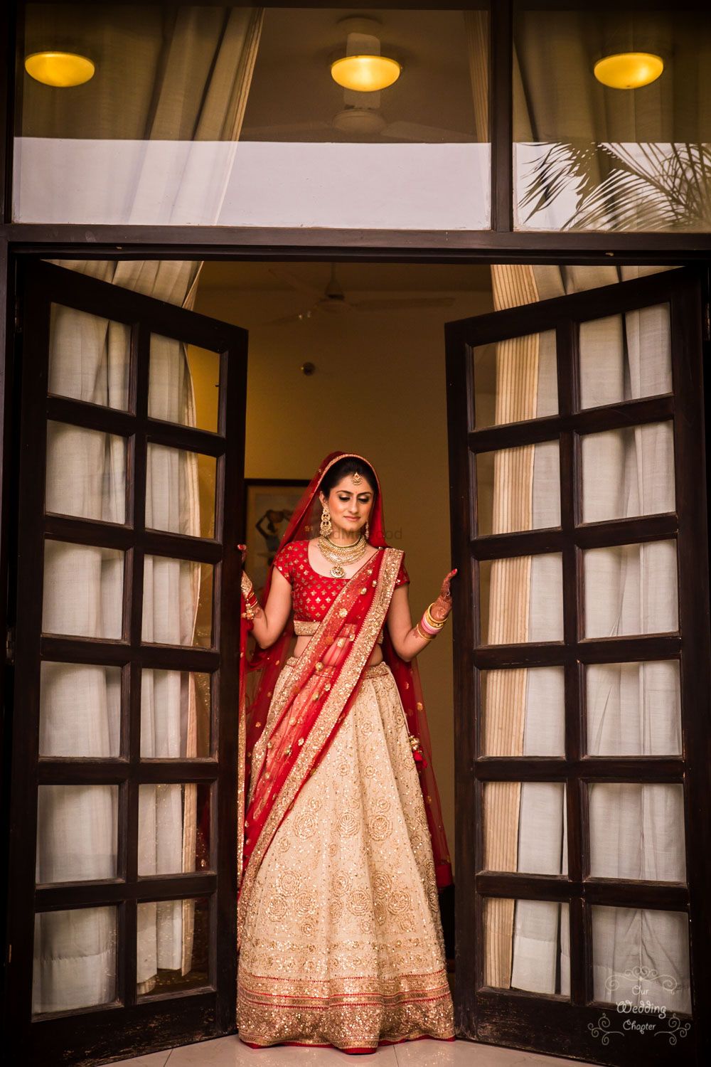 Photo of Simple bridal lehenga with red blouse and gold skirt