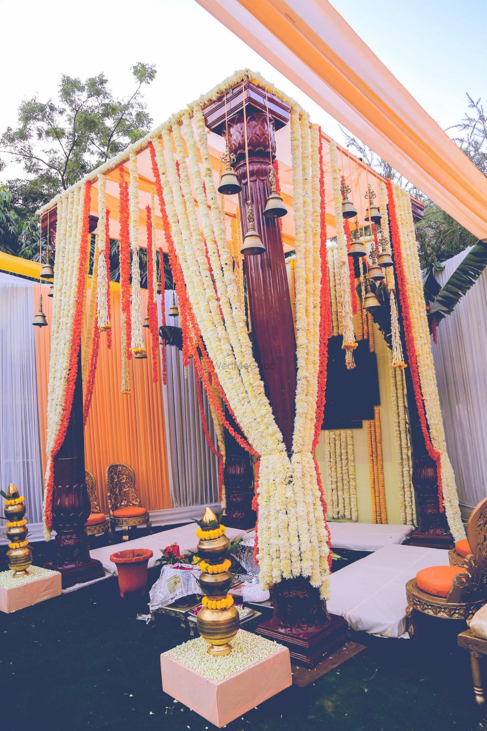 Photo of All floral South Indian mandap decor with temple bells