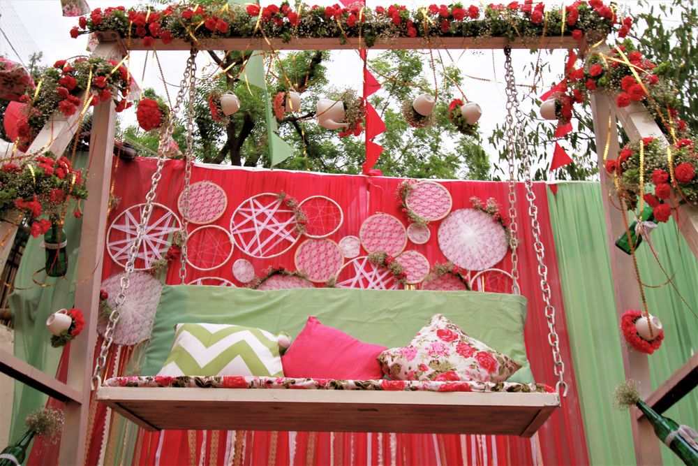 Photo of Green and pink theme decor with hanging embroidery loops