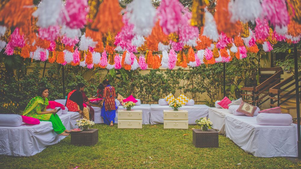 Photo of Mehendi decor idea with pink and orange tassels