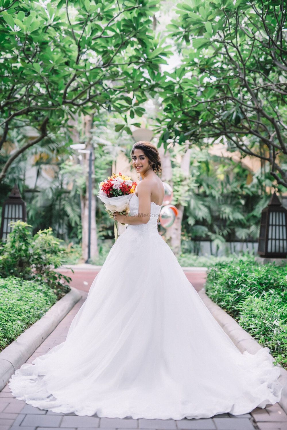 Photo of Flared white christian strapless wedding gown