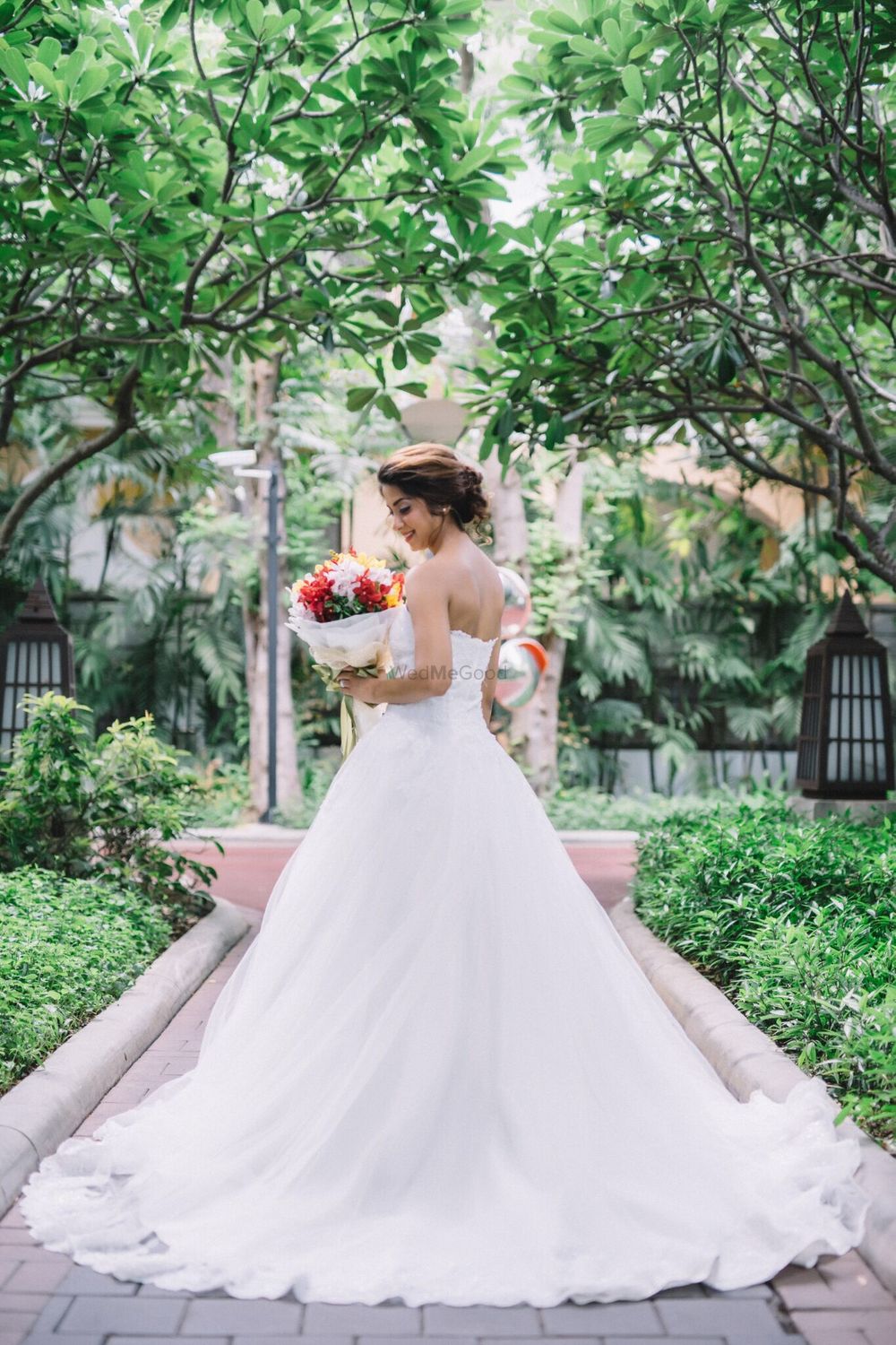 Photo of Flared white strapless christian wedding gown