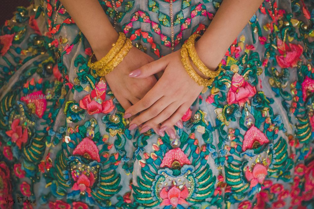 Photo of Floral threadwork lehenga in red and green for engagement