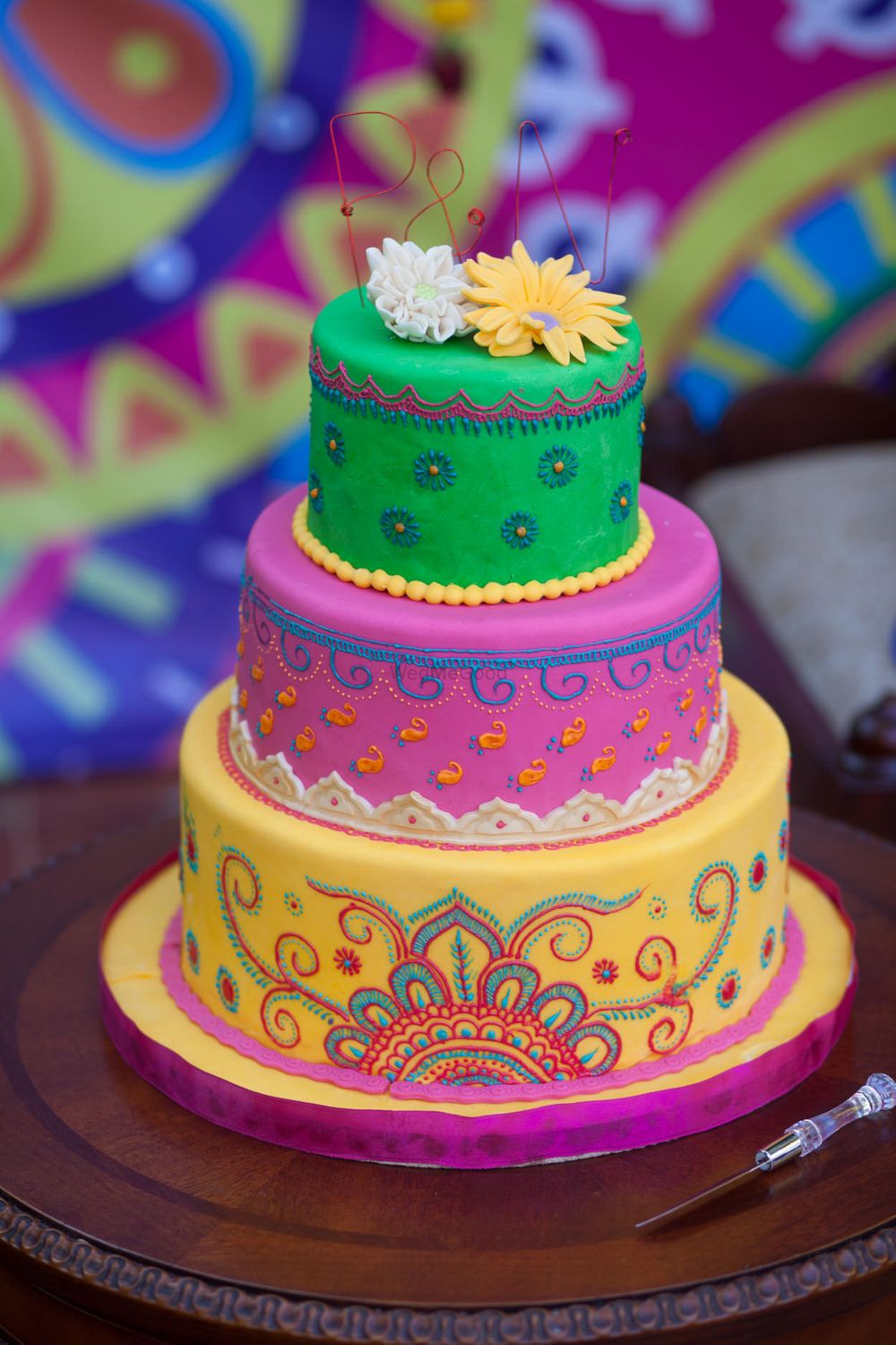 Photo of Unique colourful 3 tiered mehendi cake