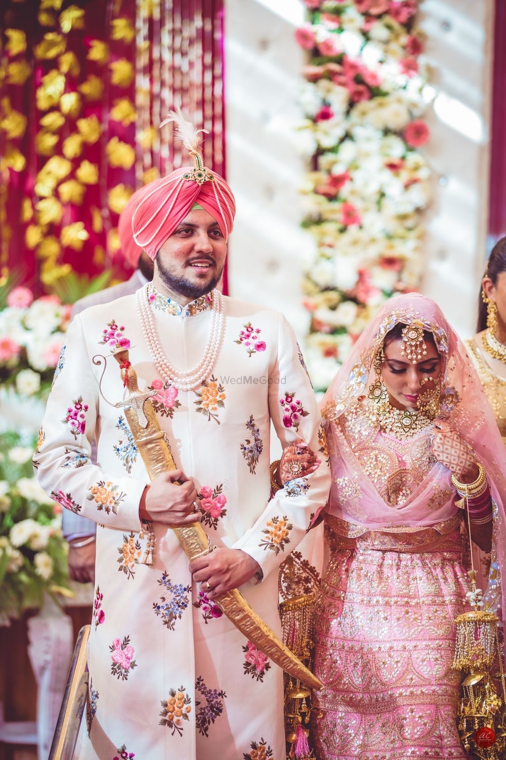 Photo of Coordinated bride and groom Sikh couple