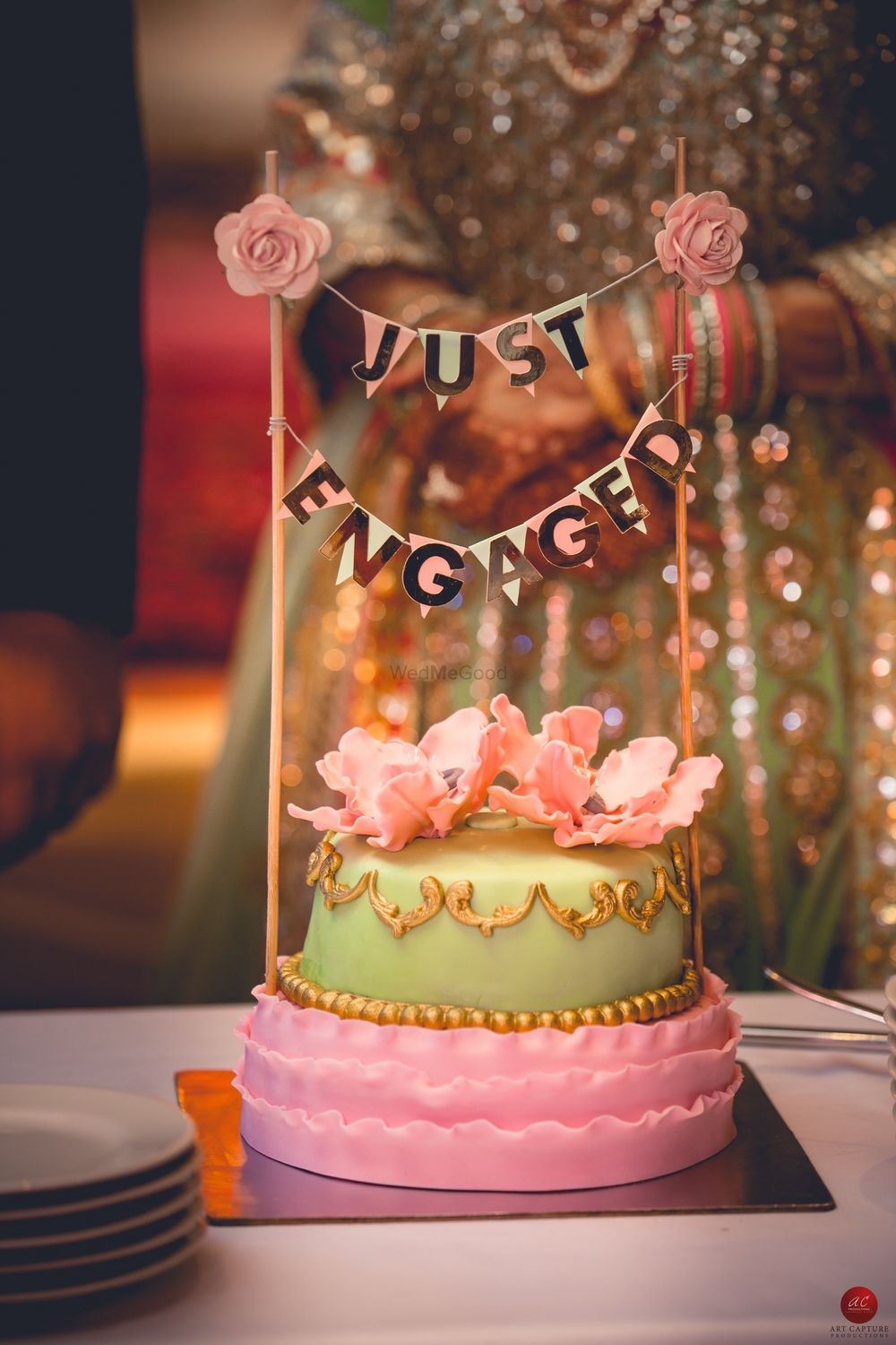 Photo of Pastel wedding cake with cute cake topper