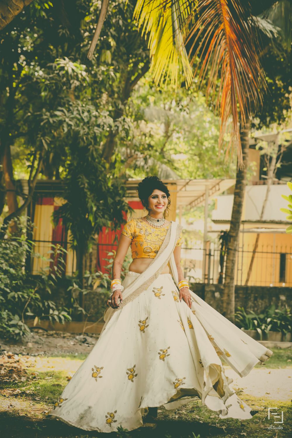 Photo of Summery floral lehenga in yellow and white