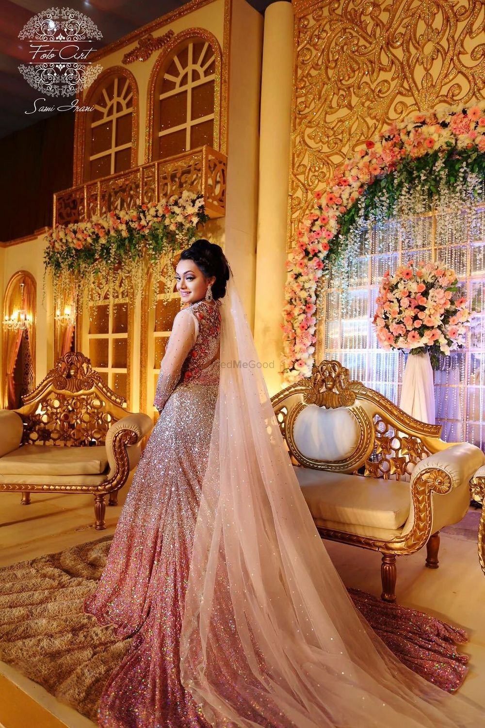 Photo of Peach and gold engagement gown with veil and train