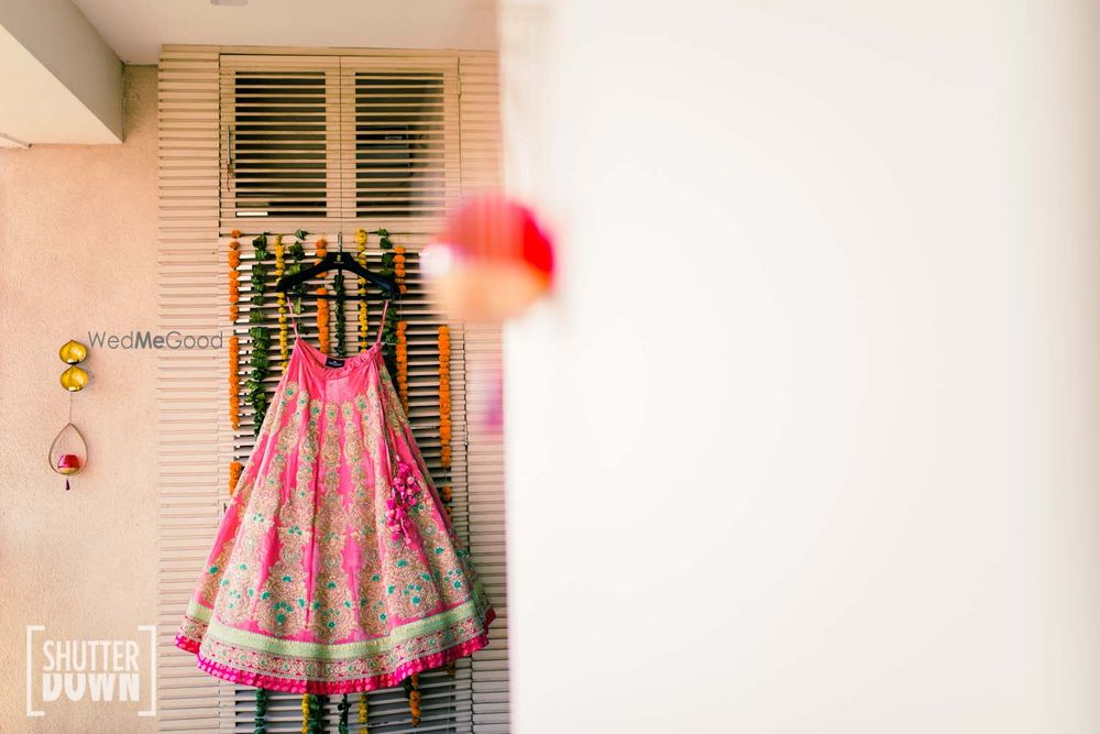 Photo of Pink lehenga on hanger shot