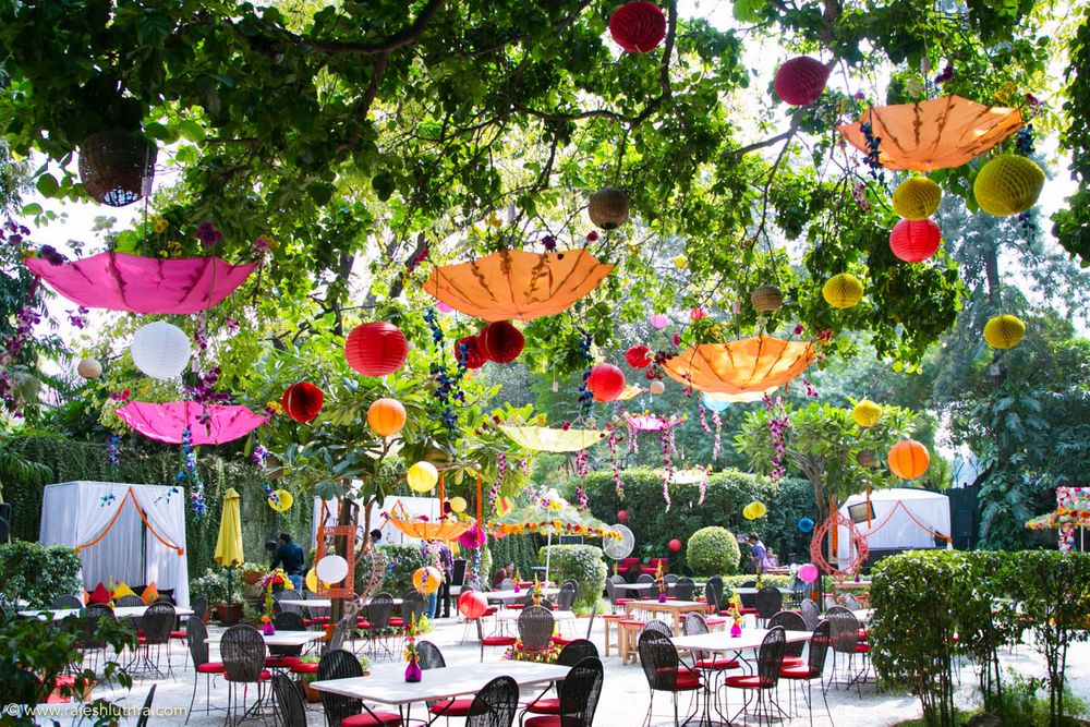 Photo of Hanging paper balls and umbrellas in decor