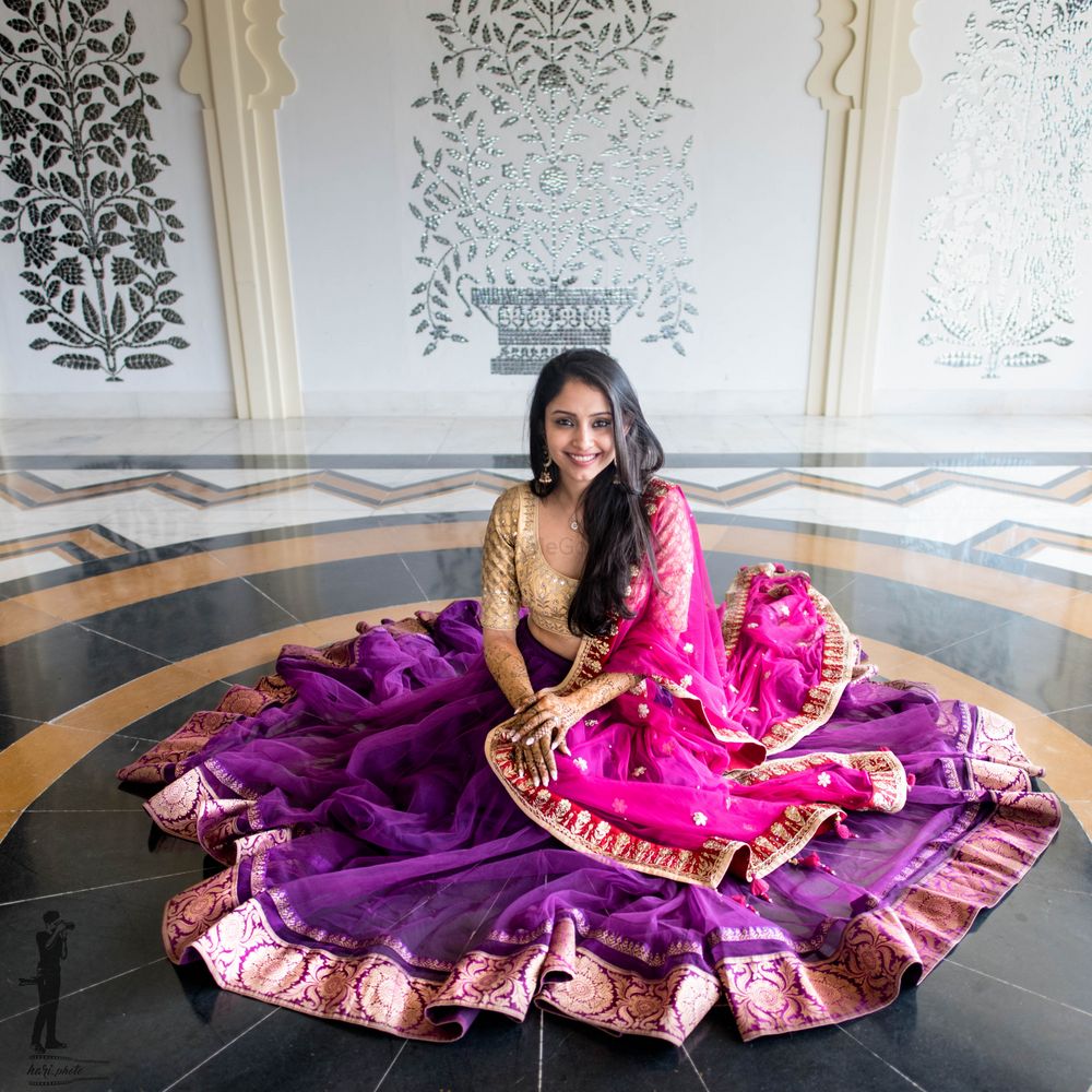 Photo of Flared out mehendi lehenga in purple and pink