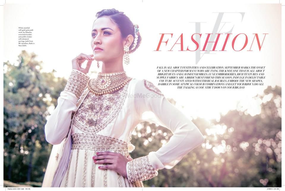 Photo of white and gold anarkali suit