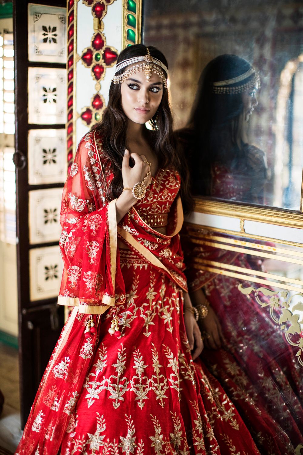 Photo of Classic red and gold bridal lehenga