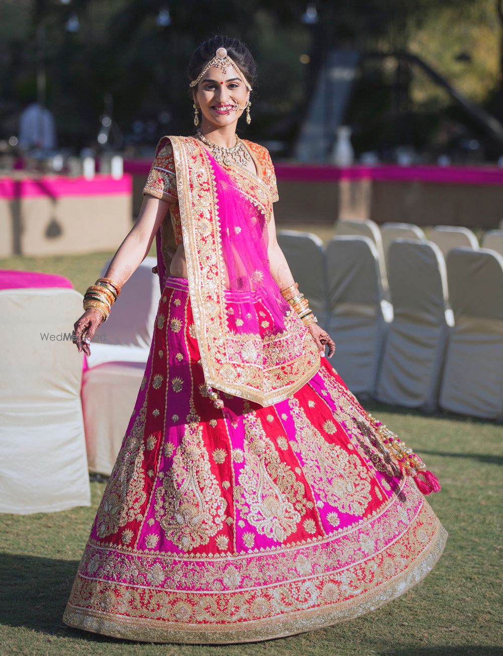 Photo of red and pink bridal lehenga