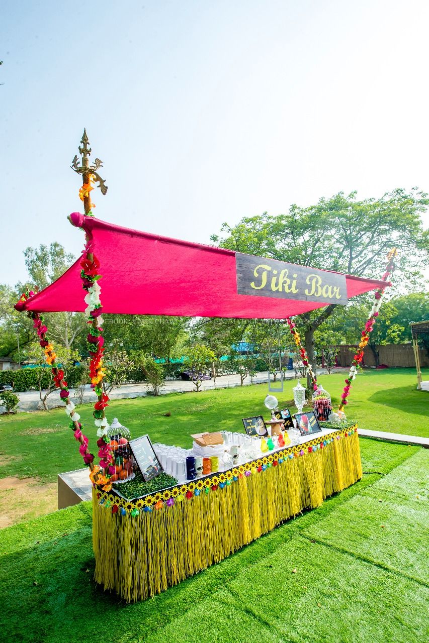 Photo of Yellow and pink food stall with florals