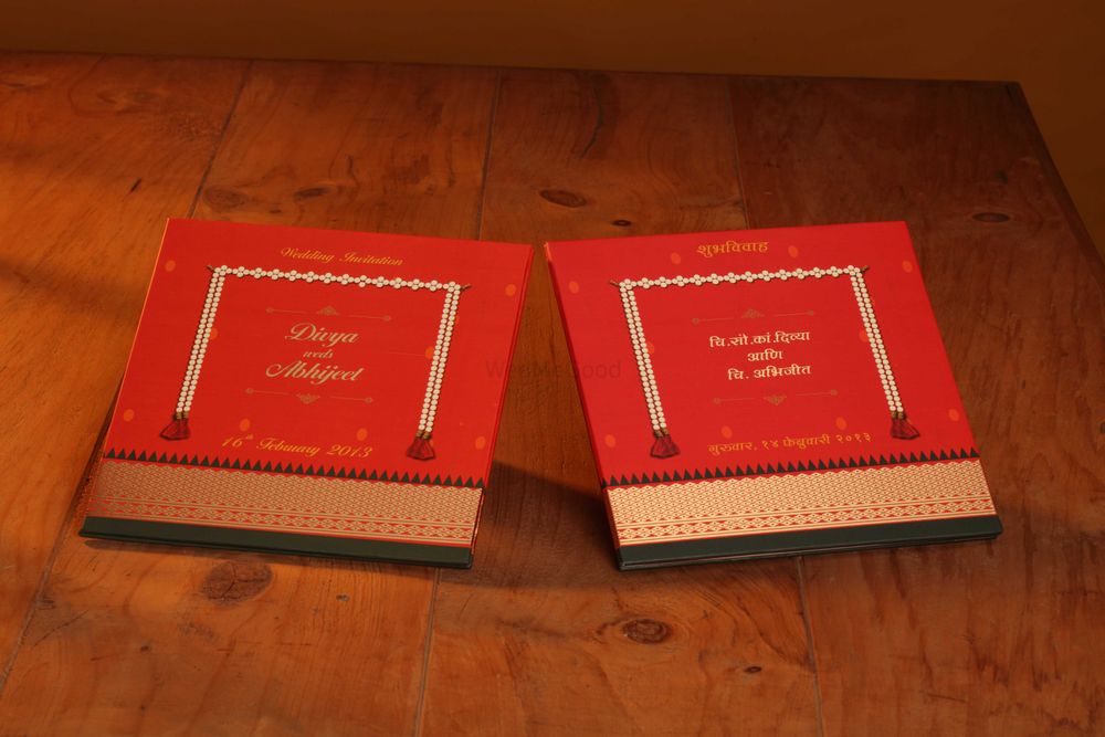 Photo of red and gold wedding invite