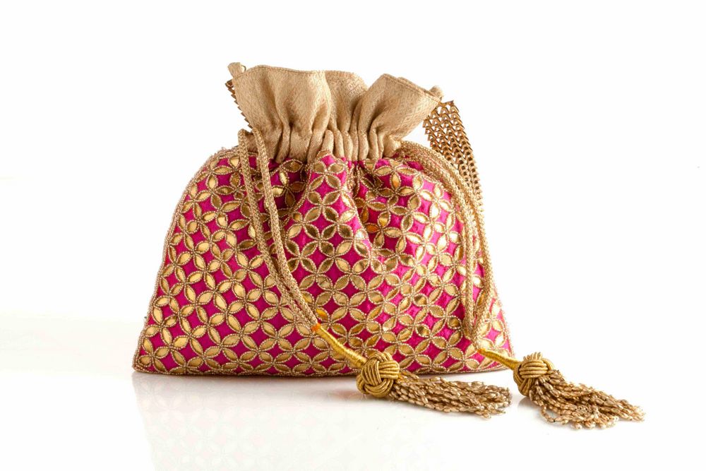 Photo of pink and gold potli bag
