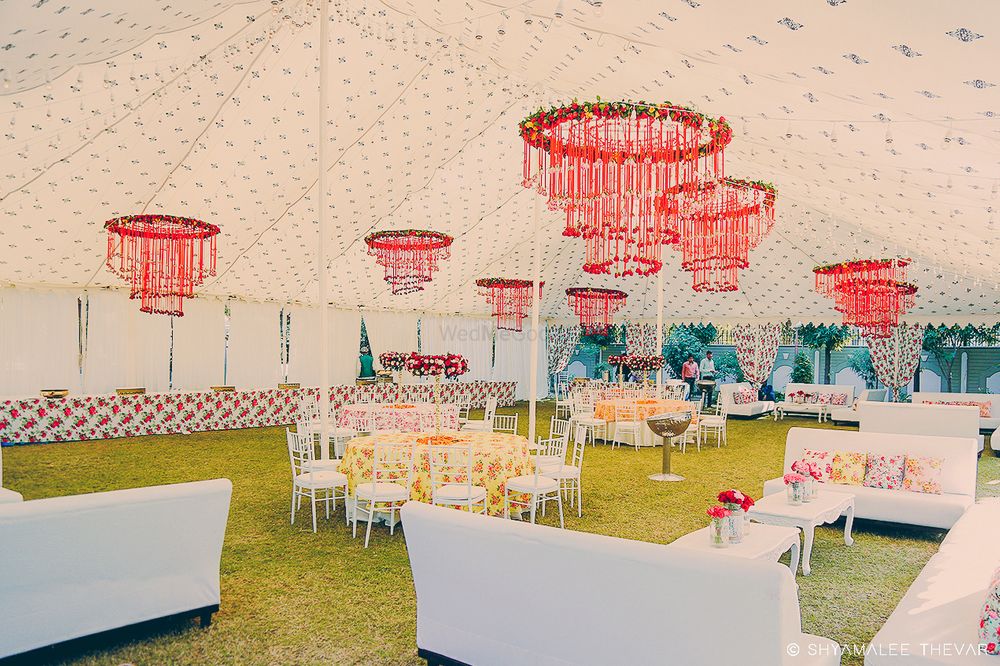 Photo of Red floral chandeliers in day decor