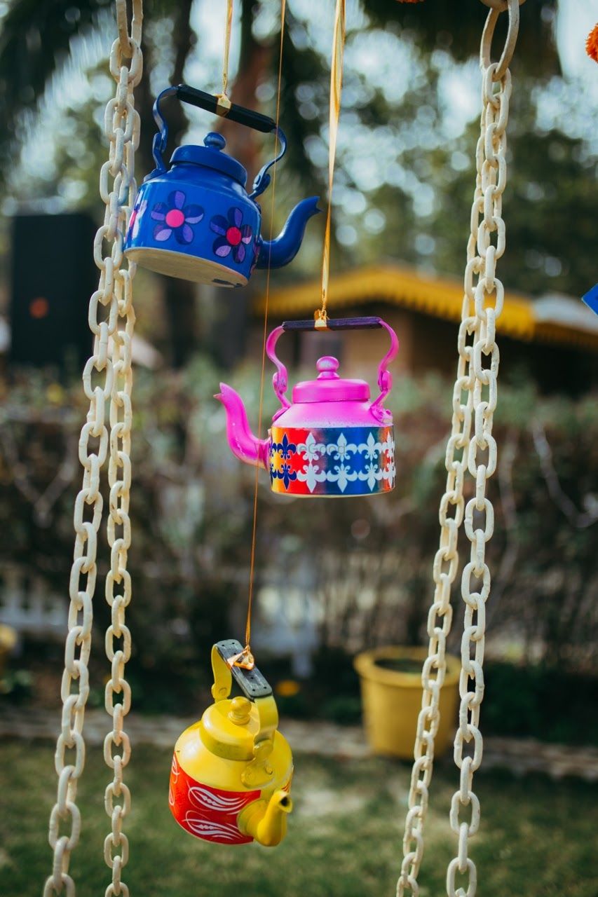 Photo of  Hanging Colorful tea kettles in decor