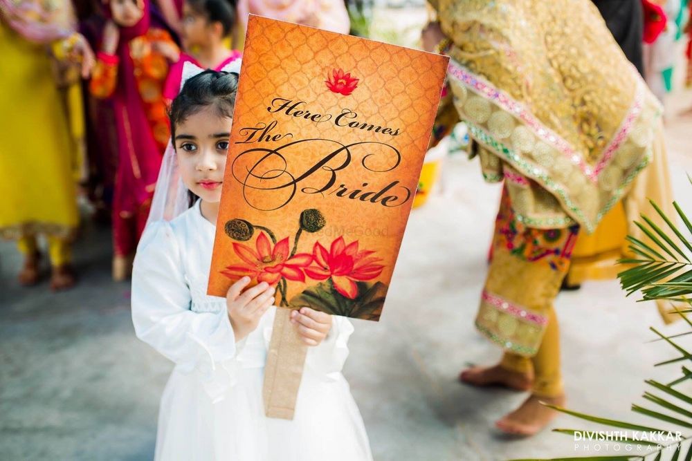 Photo of Brides niece holding entry banner