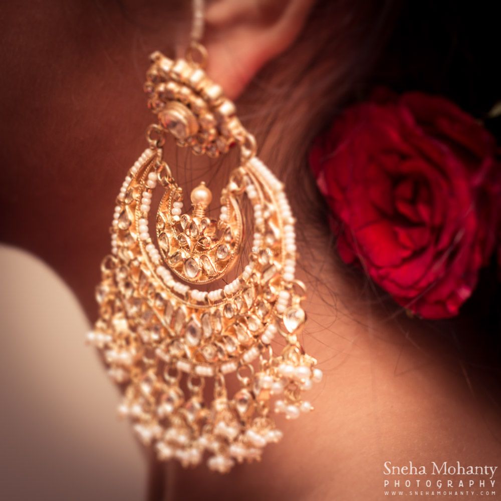 Photo of white and gold earrings
