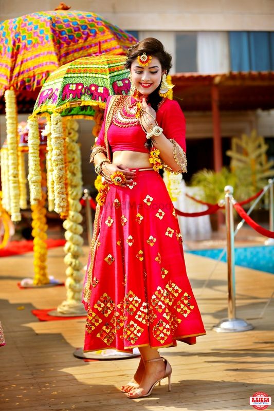 Photo of Short mehendi lehenga in red with subtle gold details