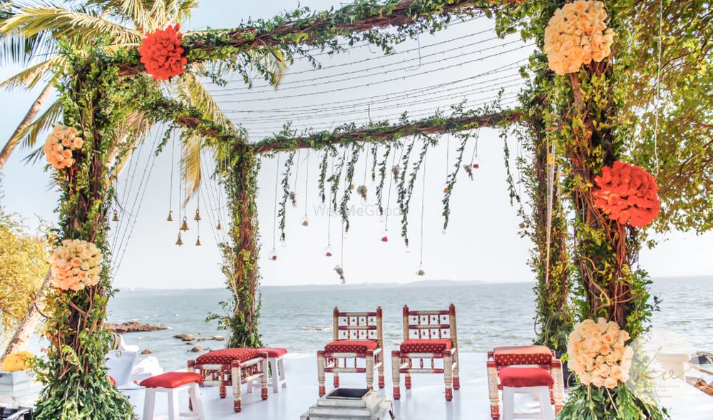 Photo of Beautiful beach side mandap done in greenery and colourful flowers