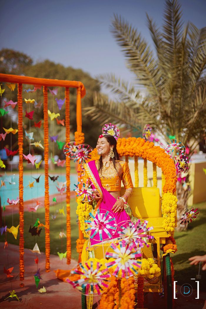 Photo of Bride entering on a decorated rickshaw