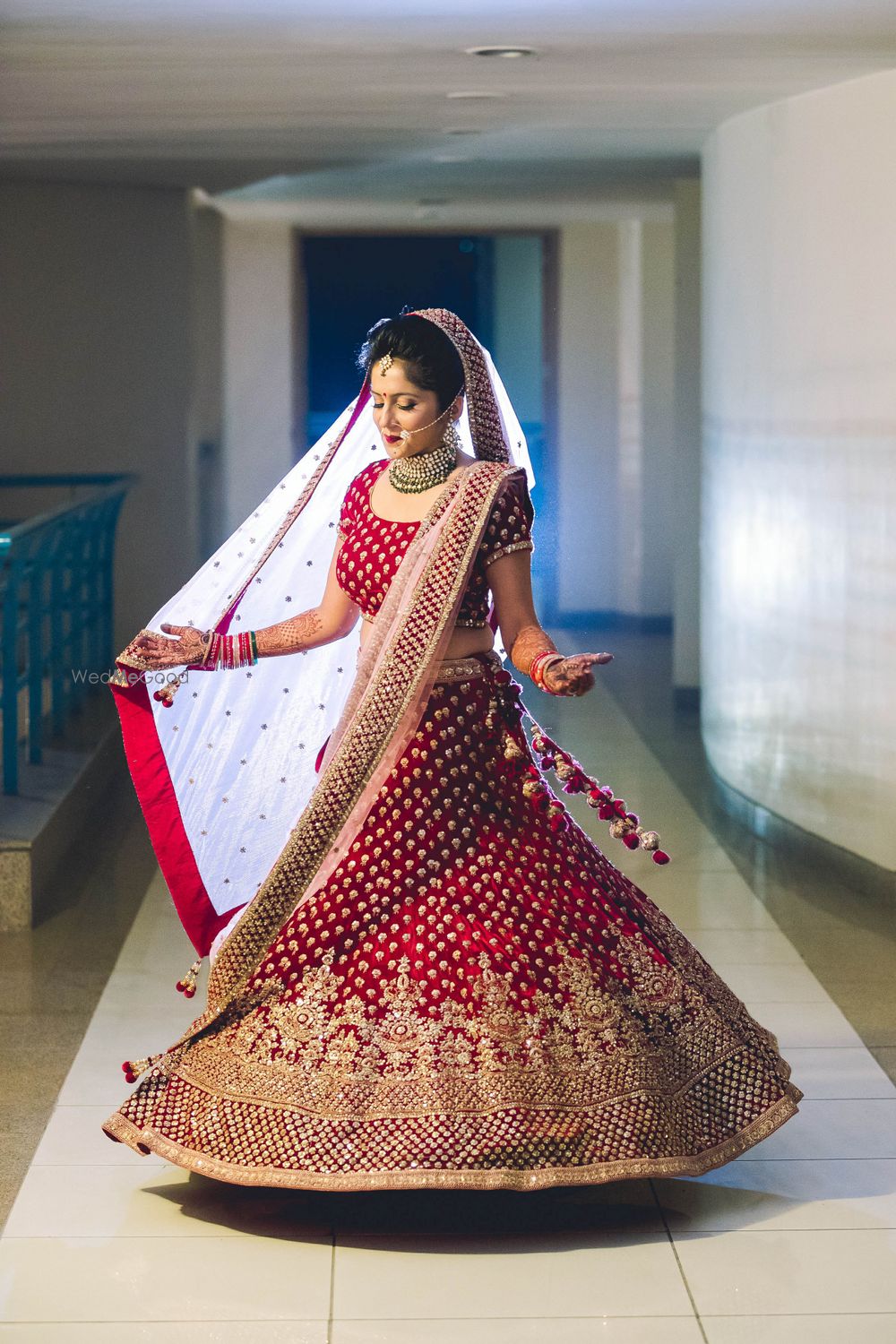 Photo of Twirling bride in red and gold