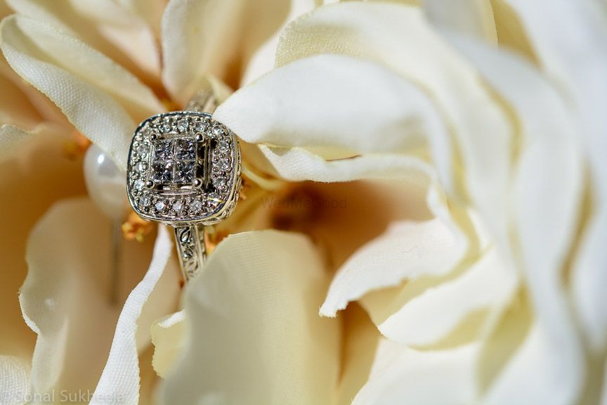 Photo of halo setting engagement ring