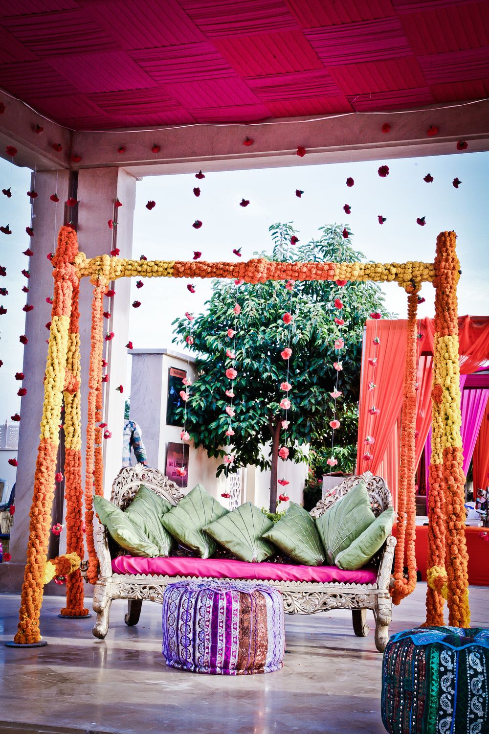 Photo of Mehendi jhoola decor with marigolds