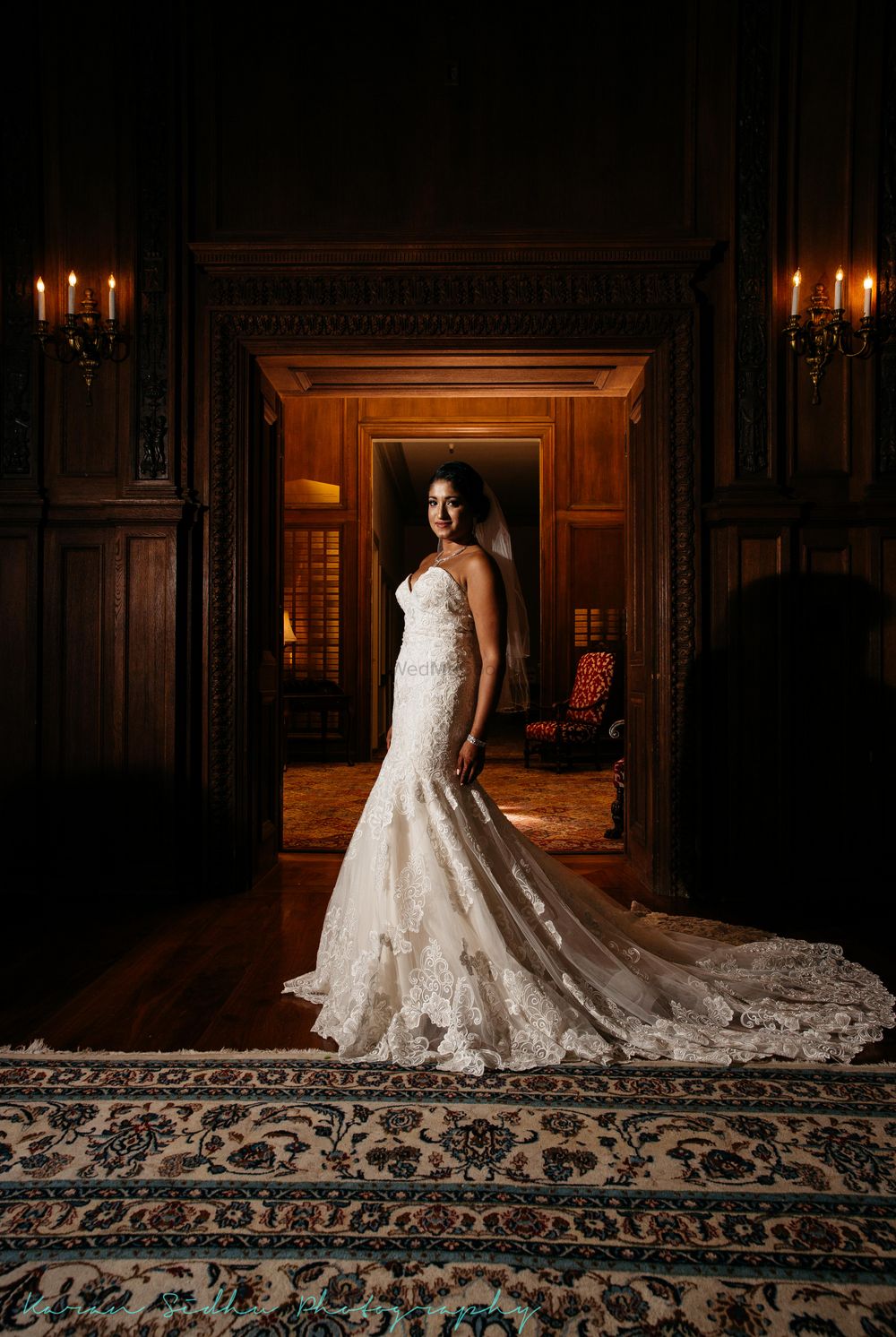 Photo of White christian wedding gown with trail and lace detailings
