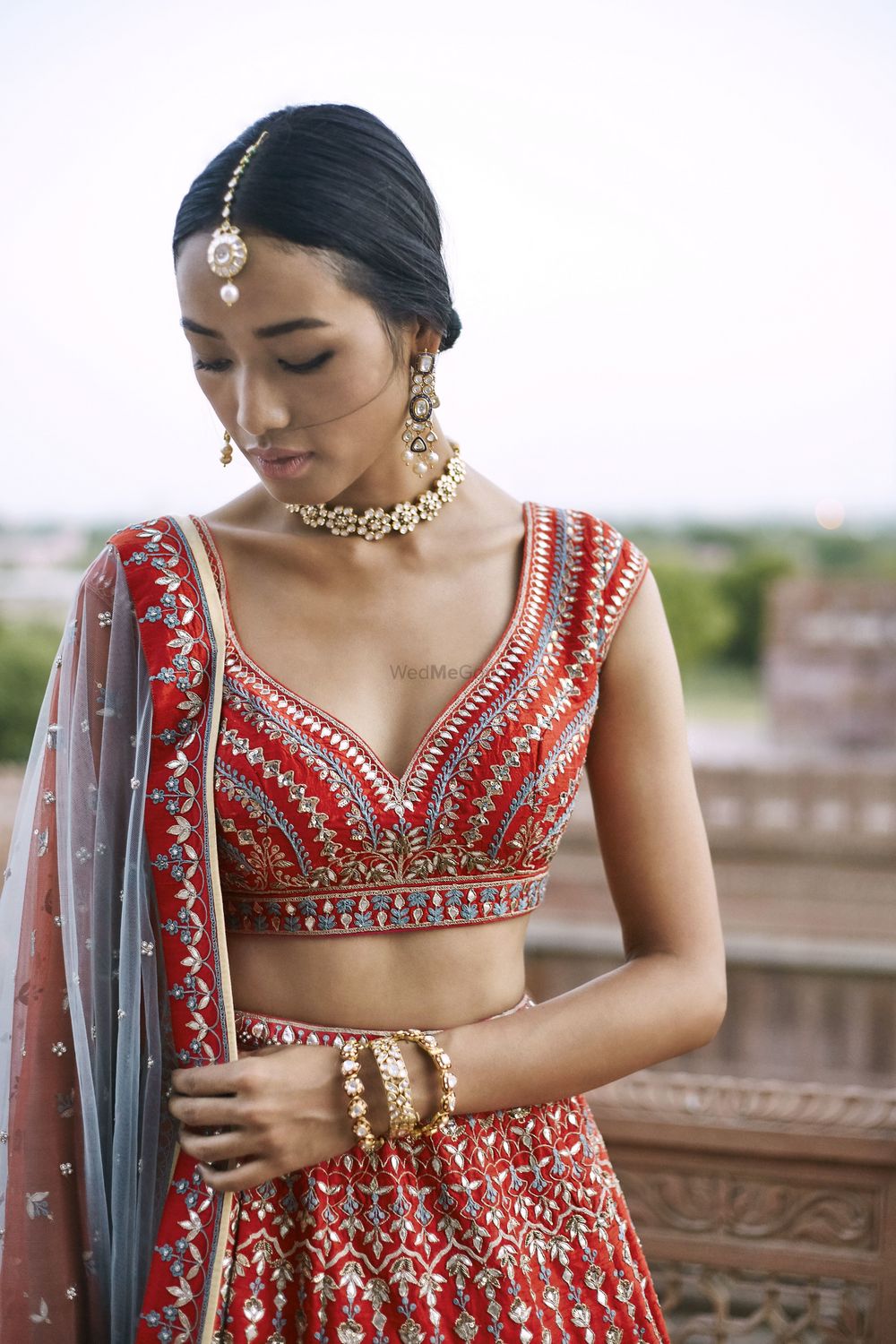 Photo of Red anita dongre lehenga with unique blouse