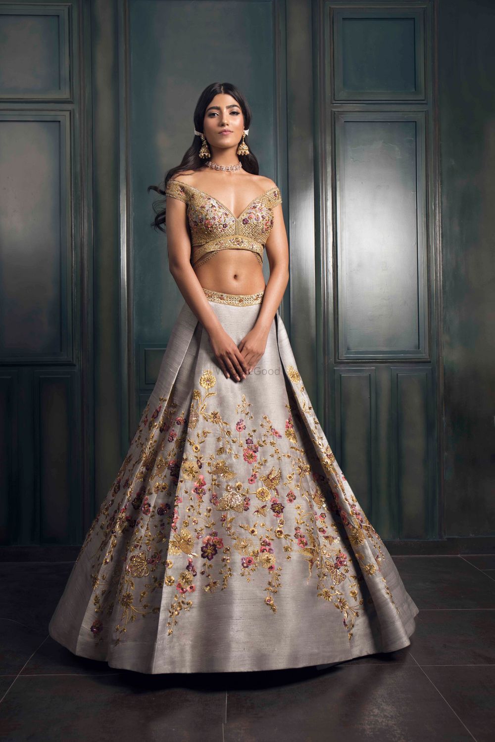 Photo of Light grey lehenga with multicolored embroidery and gold detailings