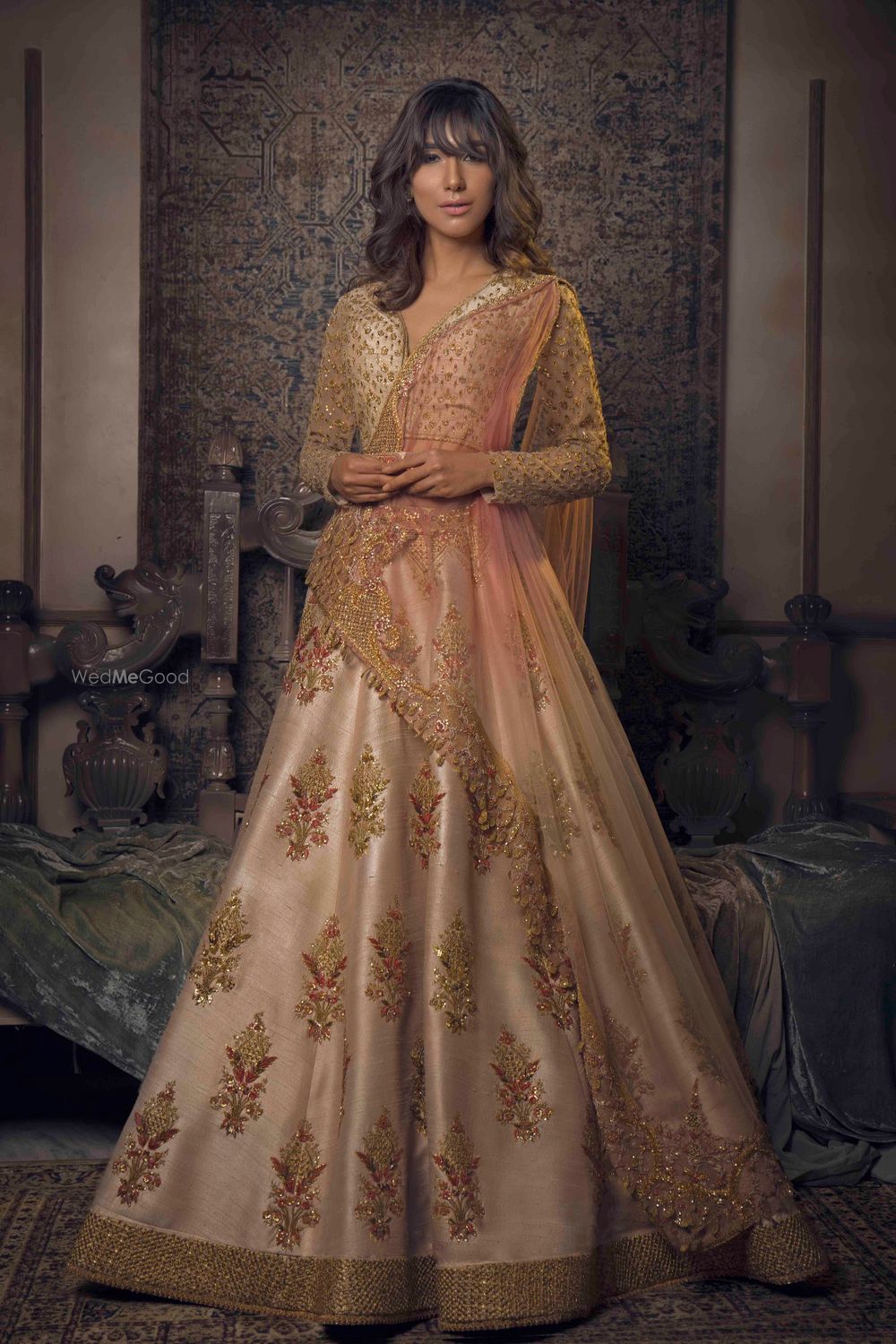 Photo of Elegant peach and gold lehenga