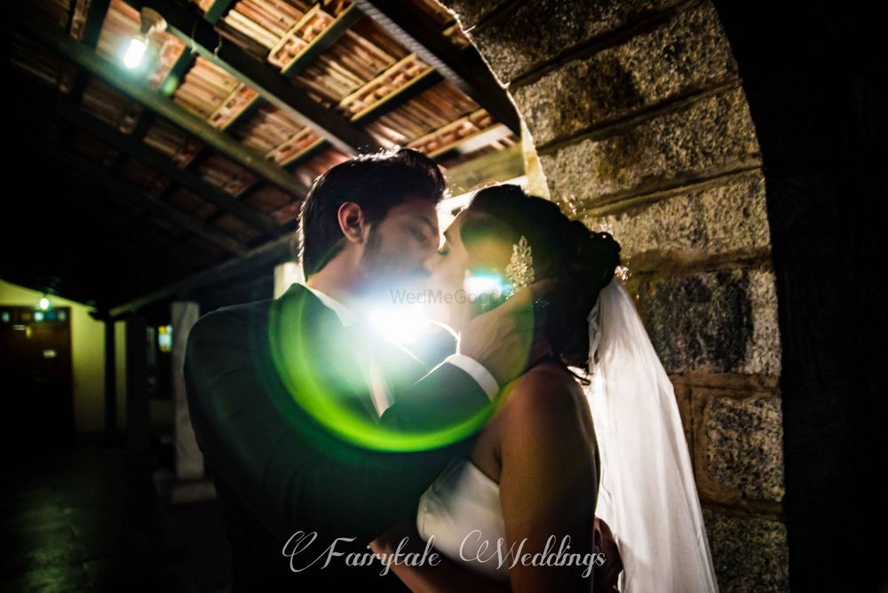 Photo of Couple kissing portrait with lens flare