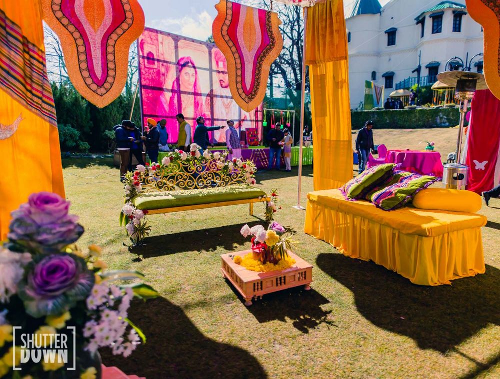 Photo of Mehendi decor idea with yellow and pink theme