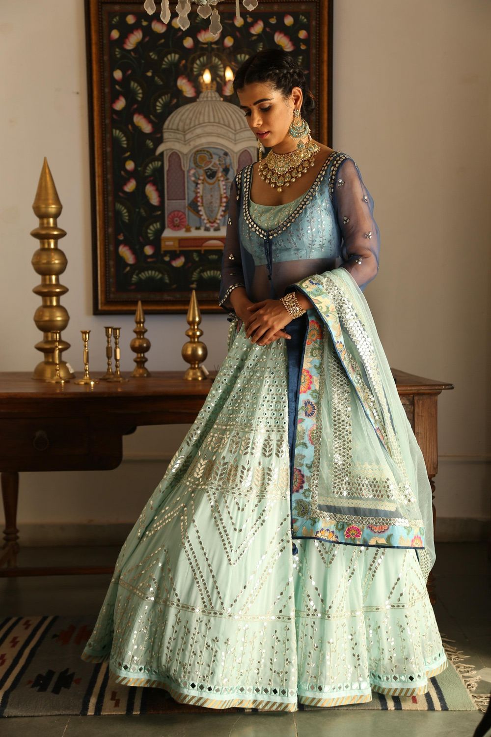 Photo of Gorgeous cape lehenga in tones of blue and floral print border dupatta