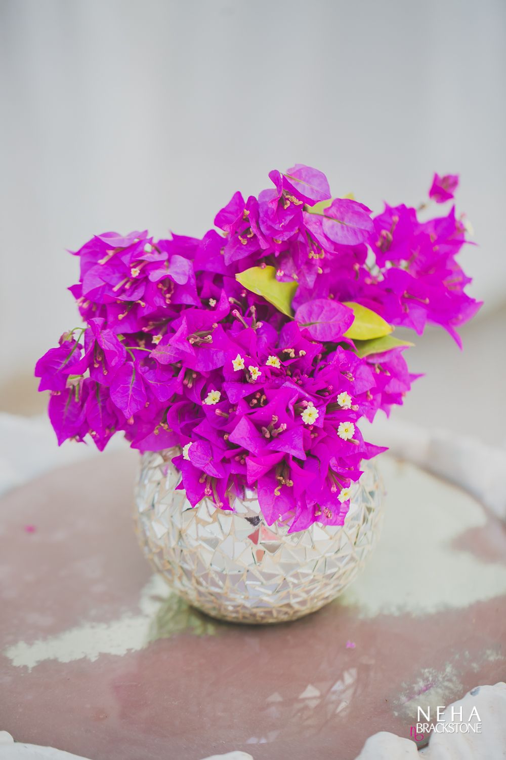 Photo of Floral centrepiece with Bougainvilla in vase
