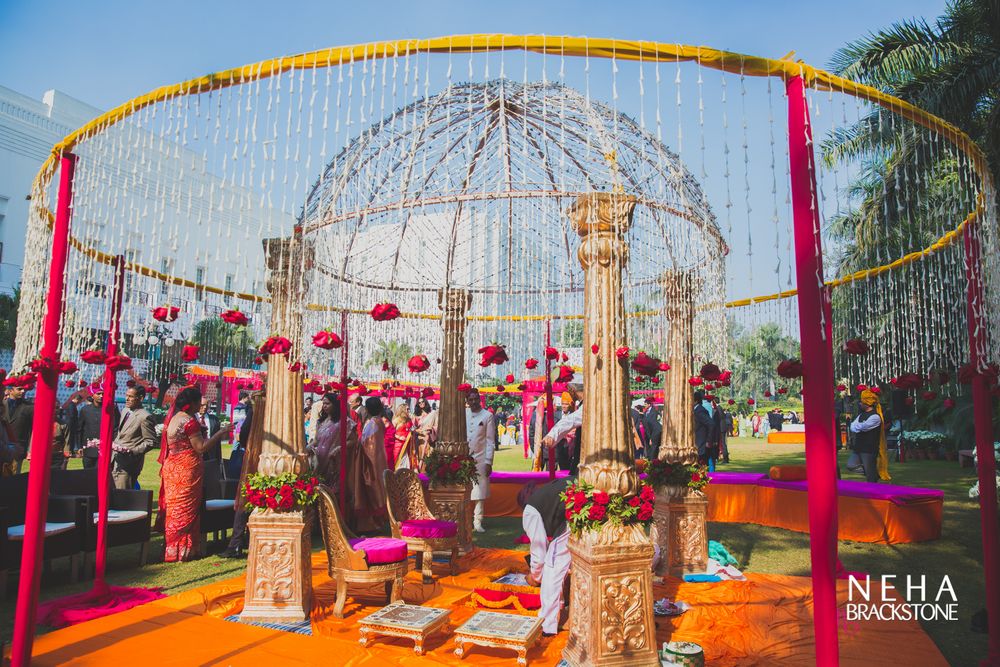 Photo of Round mandap with frame and hanging floral strings