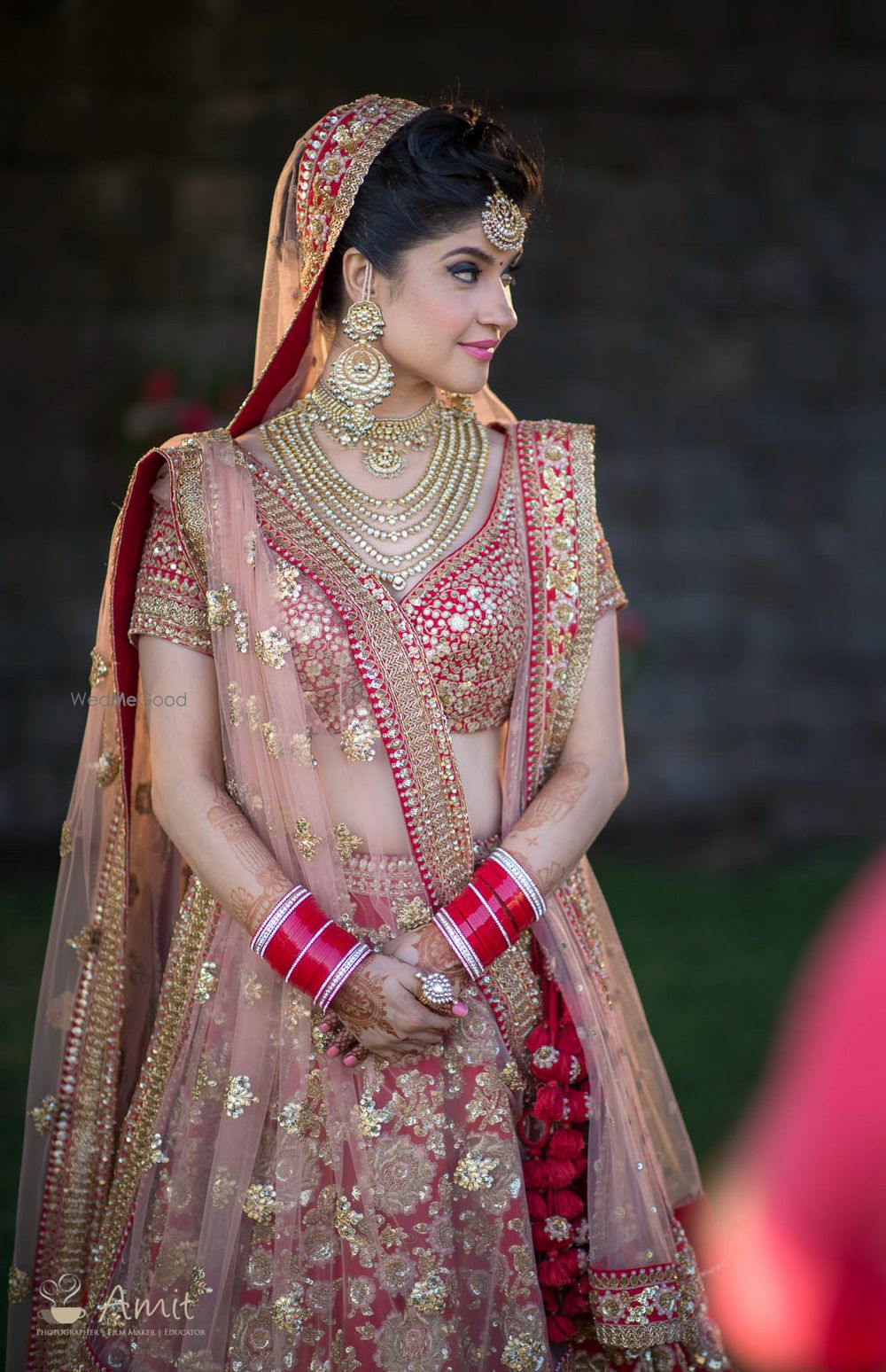 Photo of Red bridal lehenga with gold sequin work