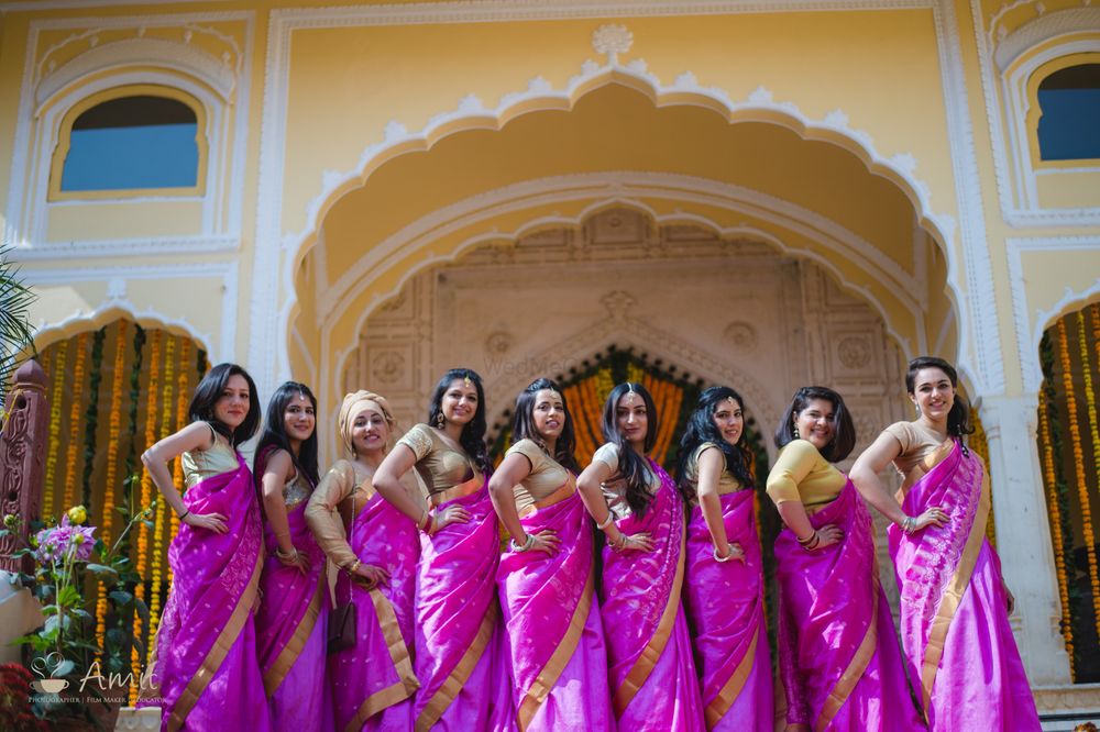 Photo of Coordinated bridesmaids in pink sarees