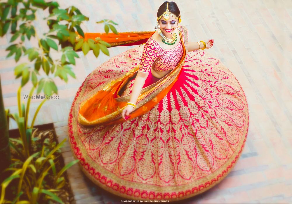 Photo of Stunning twirling bride top shot