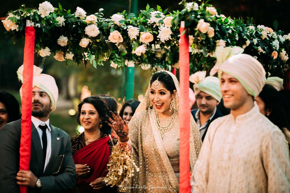 Photo of Happy bride under green phoolon ki chadar