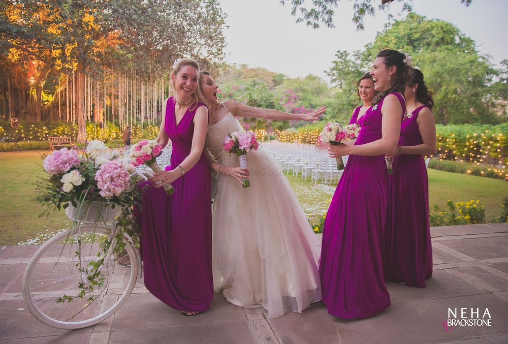 Photo of Candid Bride with bridesmaids shot