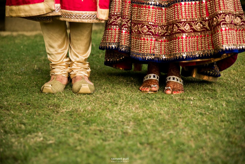 Photo of Couple feet shot with bride and grooms feet