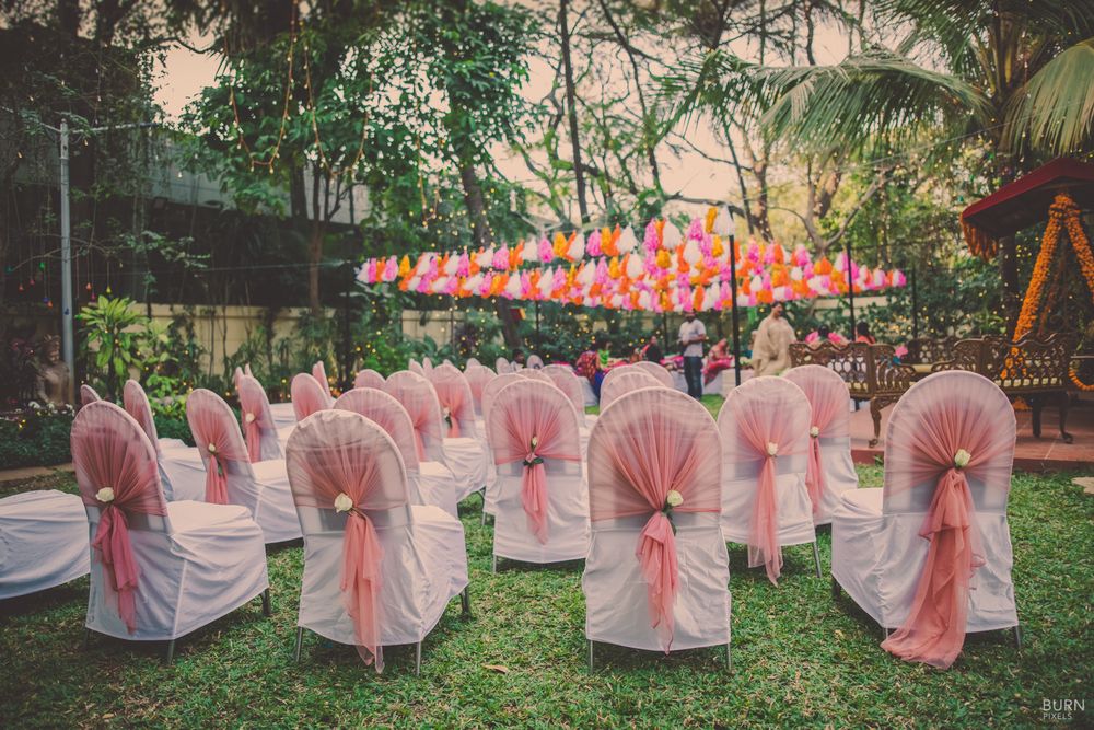 Photo of White and pink chair back decor in day functions