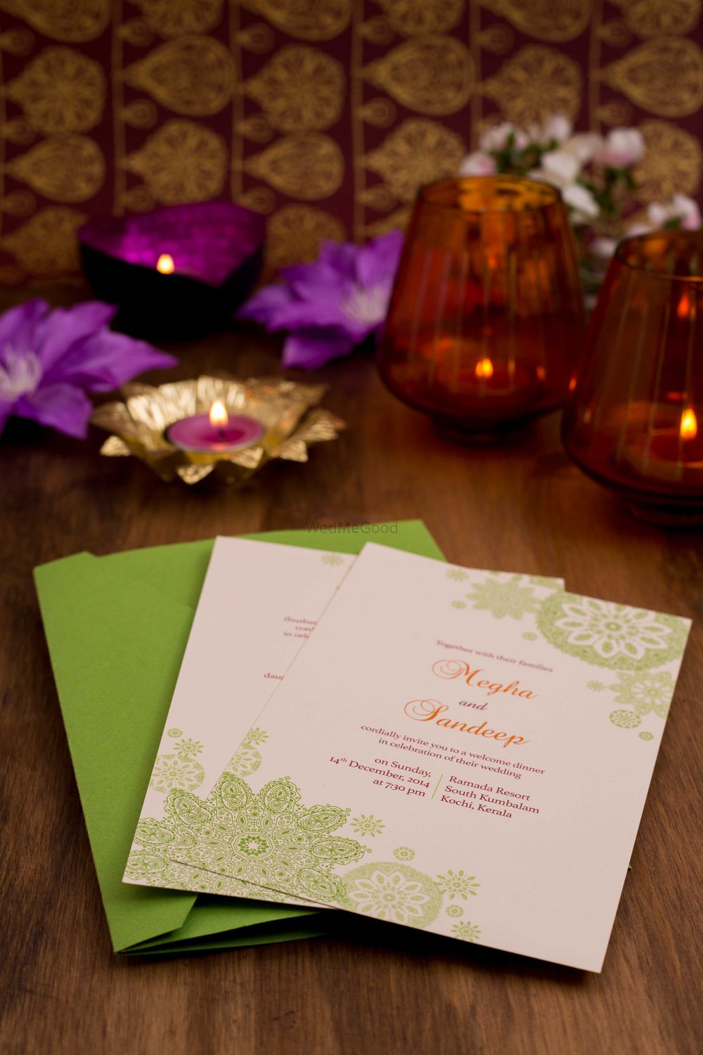 Photo of white and green wedding cards